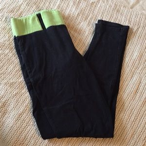 Black yoga pants with green band